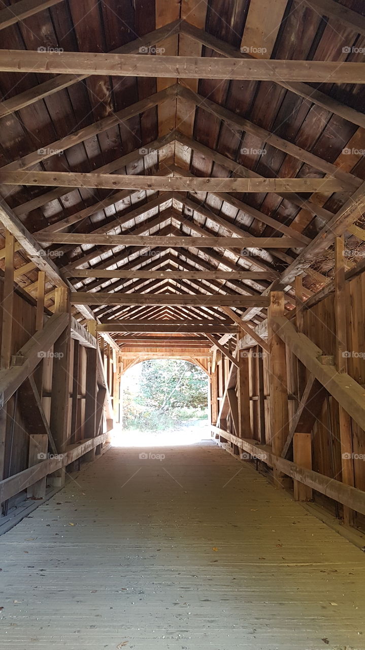 Wooden interior of a covered bridge in Vermont, USA.