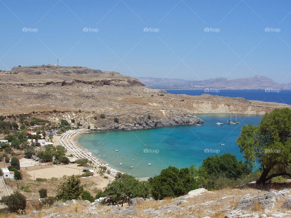 Beach and harbor in Lindos, Rhodes, Greece