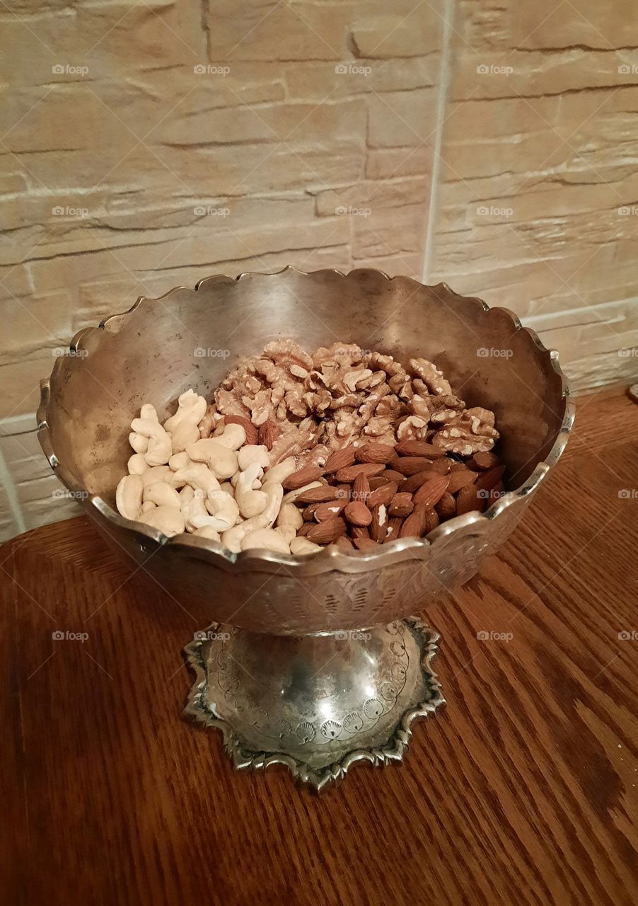 healthy snack  - bowl of three kinds of nuts