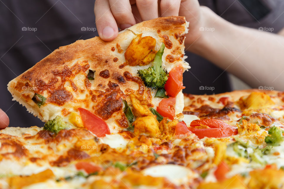 man eating pizza