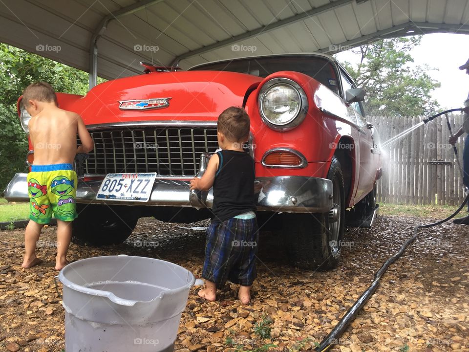 Washing a red 1955 Chevy 