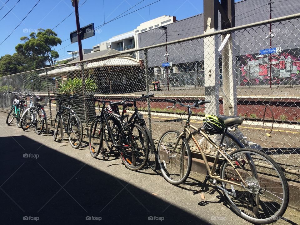 Long line of Bicycles at train station