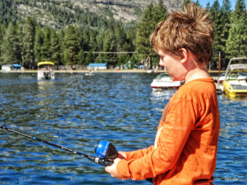 Little Boy Going Fishing. Fishing On A Mountain Lake