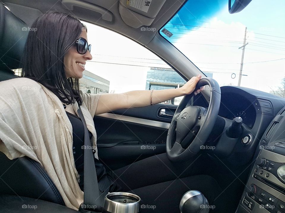 Young woman driving a car