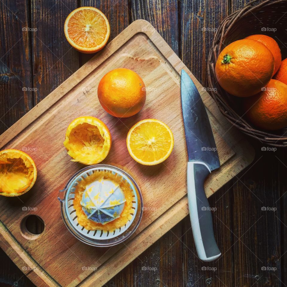 High angle view of orange fruit on cutting board