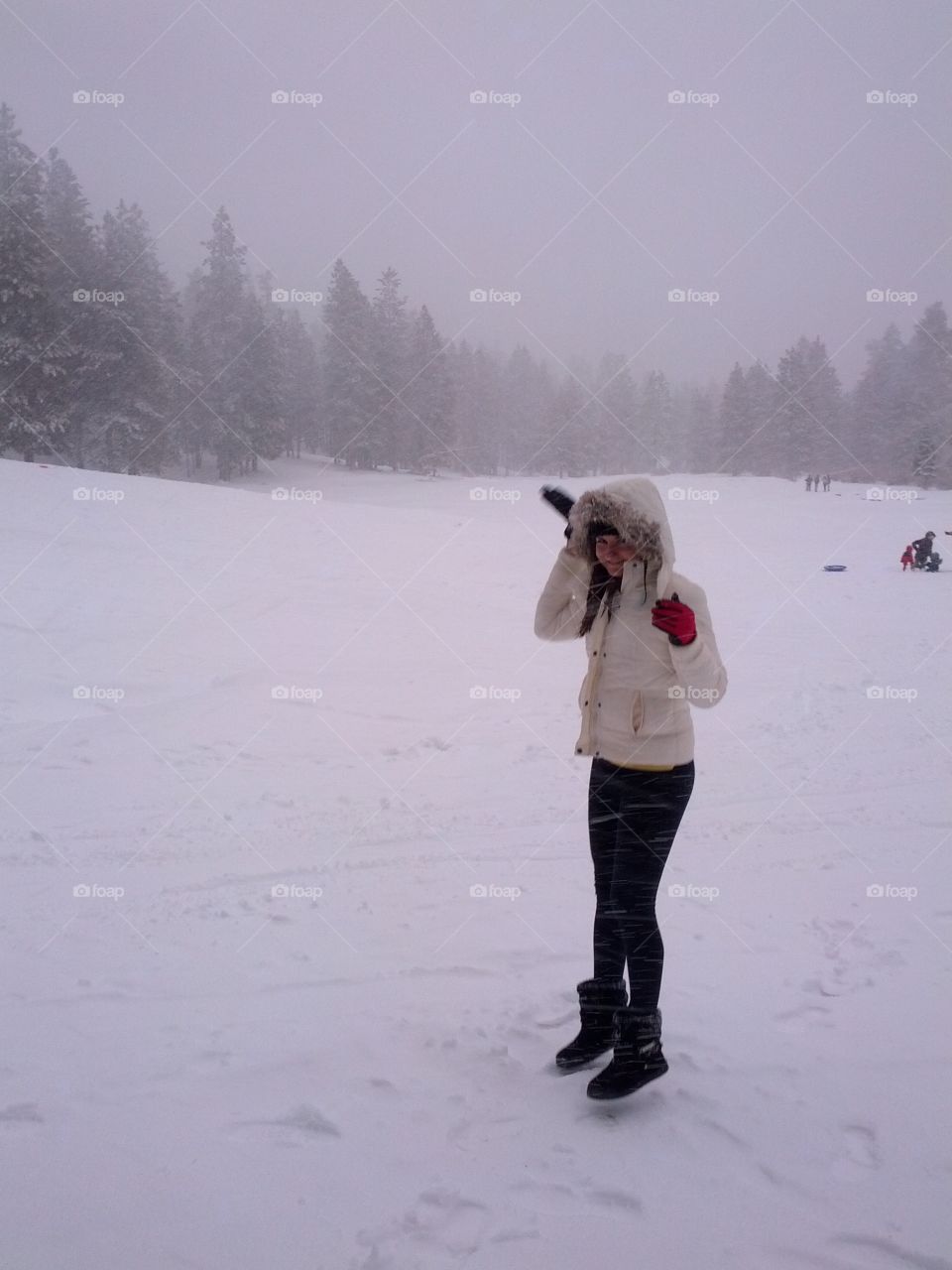 Woman standing on snowy landscape