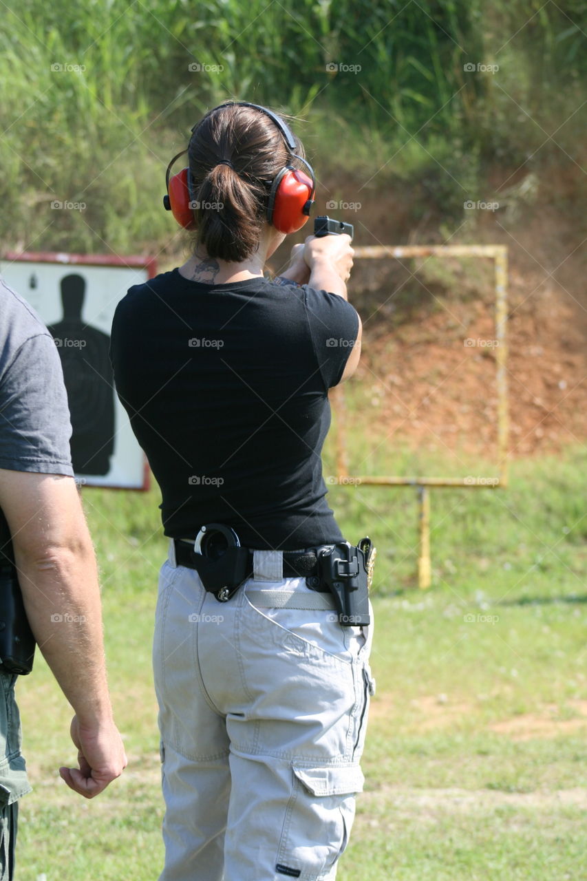 Police woman At firearms range