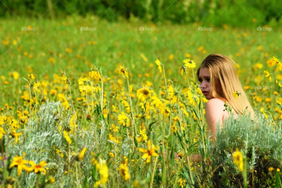 Girl in sunflower field