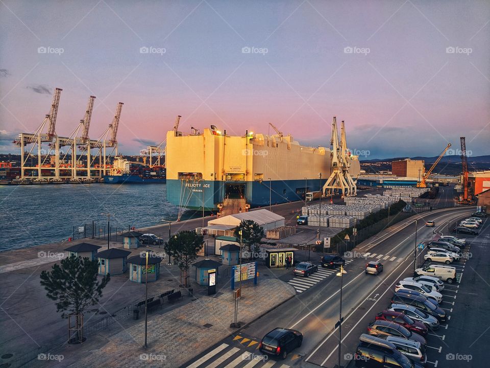 A huge merchant ship is docked at the port in Koper.