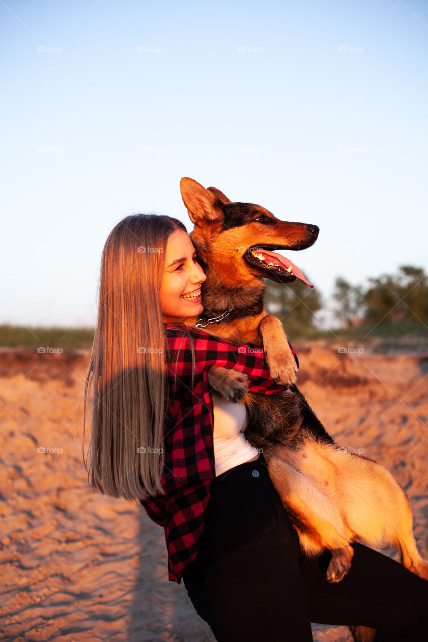 woman hugs her beloved dog