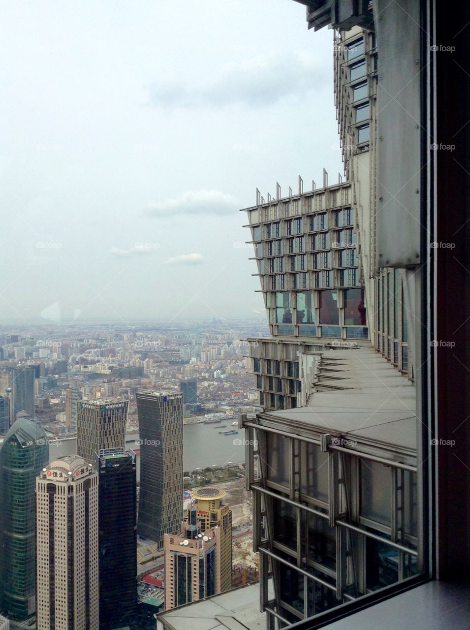 On the 88th floor of a skyscraper enjoying a panorama of Shanghai 