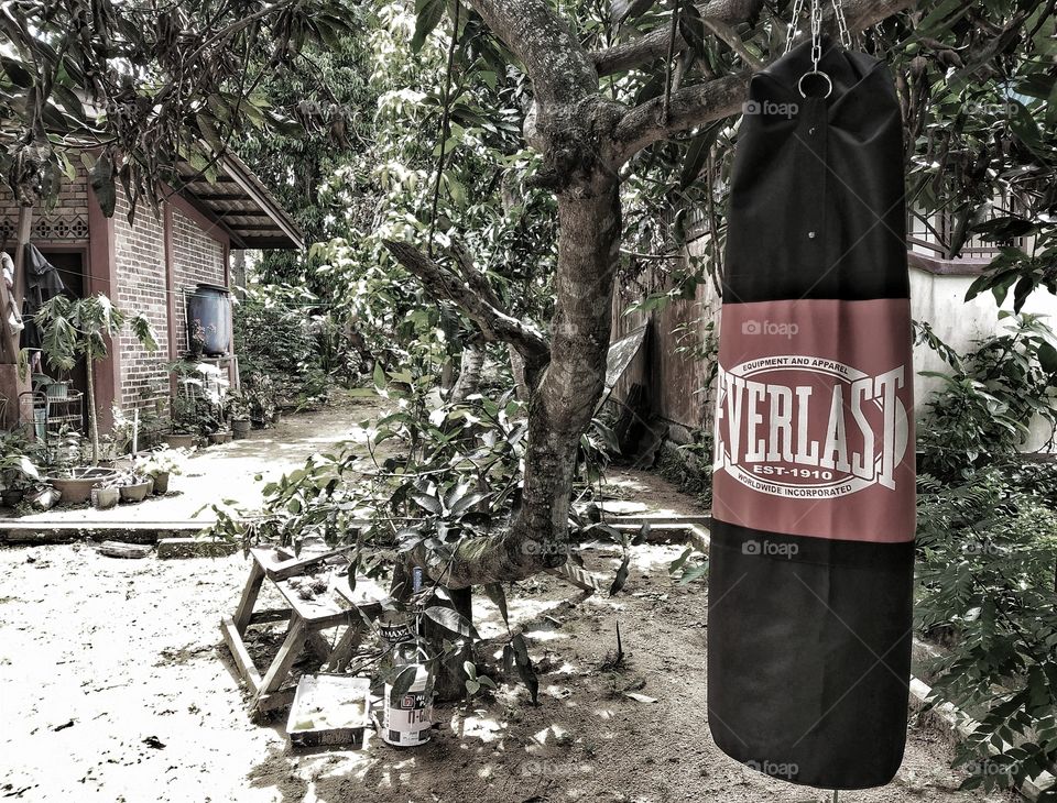 training hard with the punch bag
A punching bag is a round or cylindrical piece of athletic equipment used by professional boxers for training and by amateurs for exercise. The bags come in a variety of sizes for a variety of uses