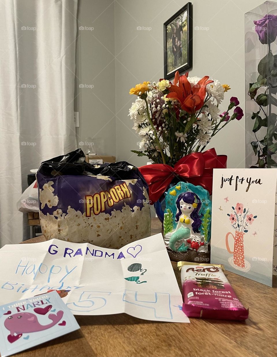 Flowers in a vase and gifts received for my birthday, I know… a bit busy, popcorn from movie, ornament hand painted, card, hand drawn picture, chocolate bar
