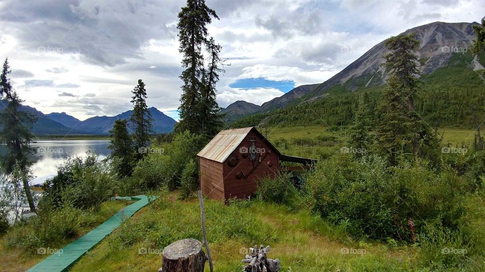 Pioneers cabin nestled in the magnificent wilderness of Alaska.