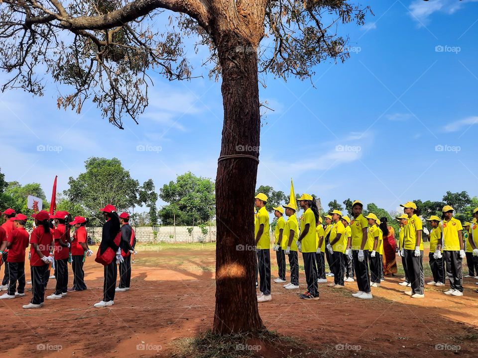 A group of kids standing for a programme