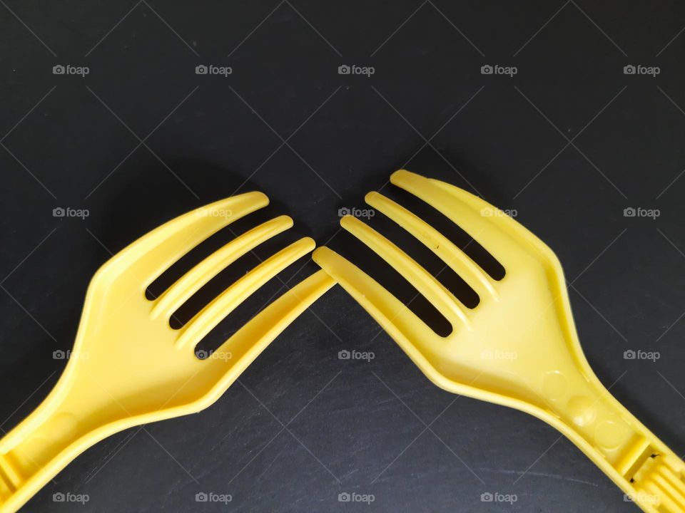 Yellow Forks on a black background