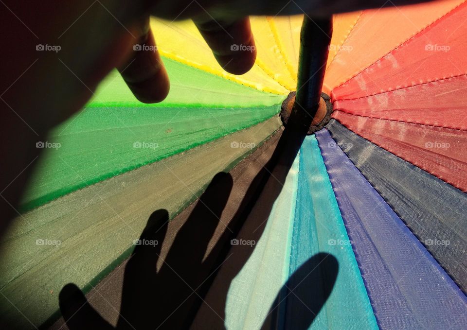 hand shadow on colorful background
