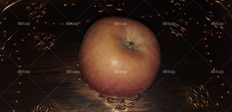 single apple on the table