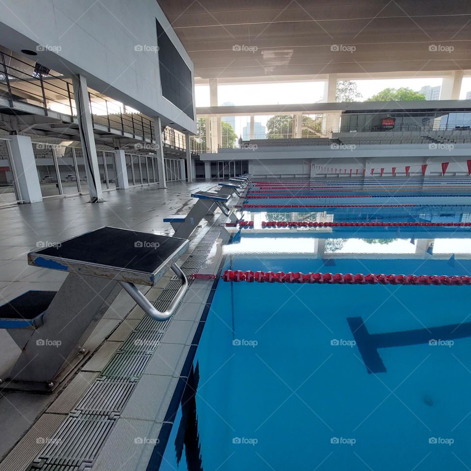 the pool area has been prepared for the swimming competition.  The swimming track has been installed in the pool and the championship is ready to start