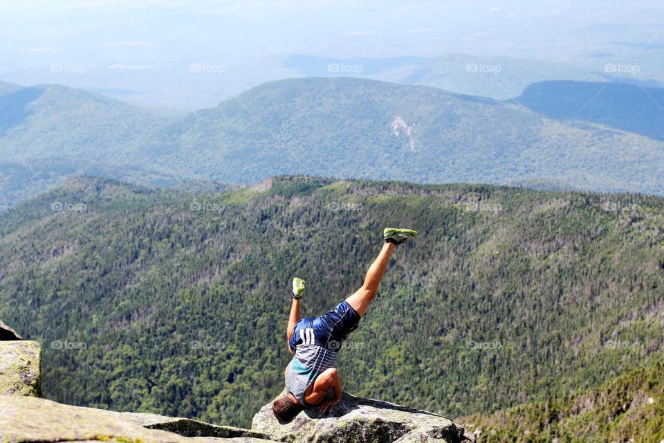 Yoga on a mountain cliff 