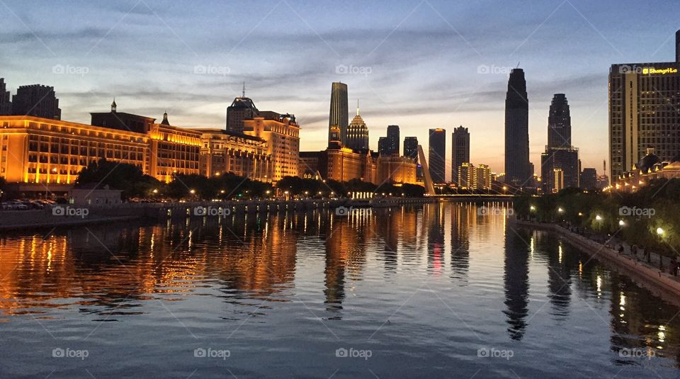 Scenic view of city at sunset