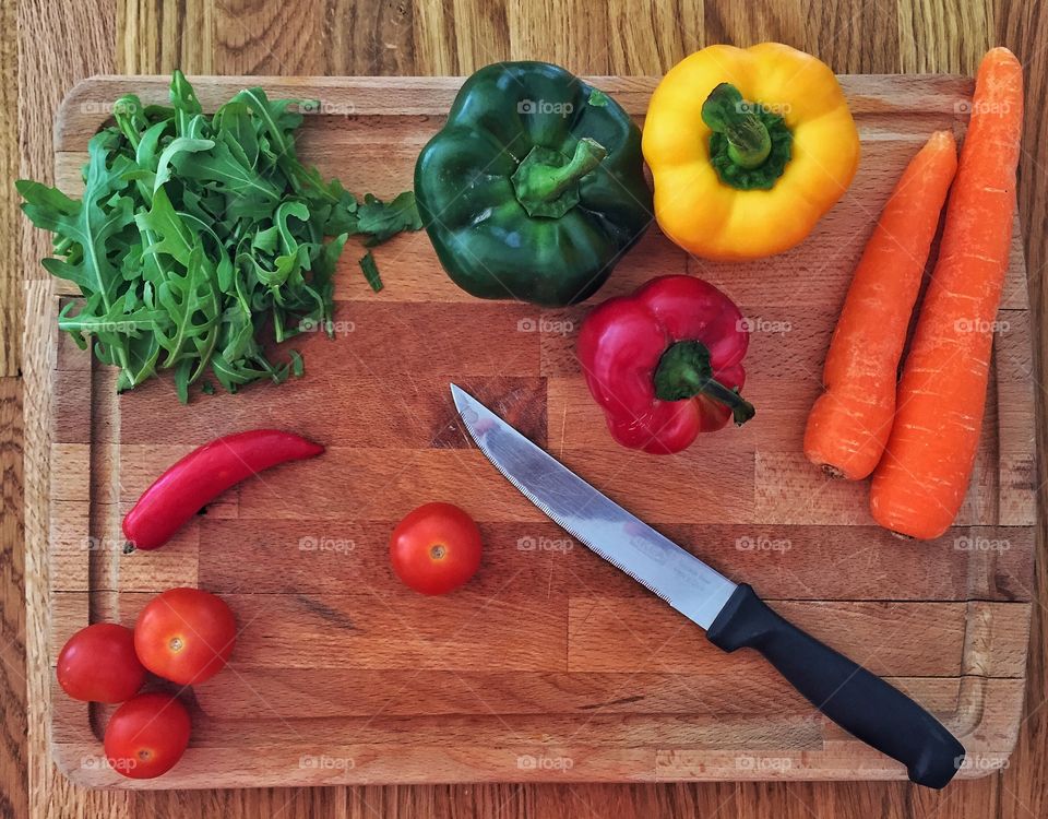 Vegetables with cutting board