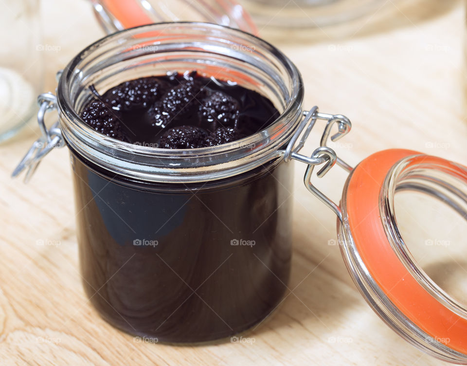 High angle view of mulberry in jar