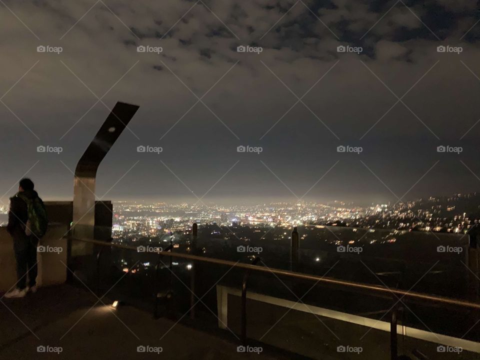 Griffith observatory view of Los Angeles from the top observation deck, smoggy night 