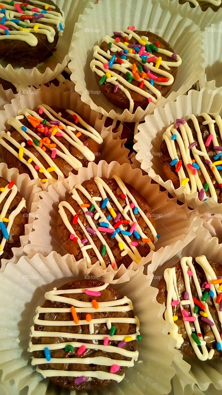 Homemade brownies Bites with a lighr drizzle of frosting and rainbow sprinkles, made by Me!