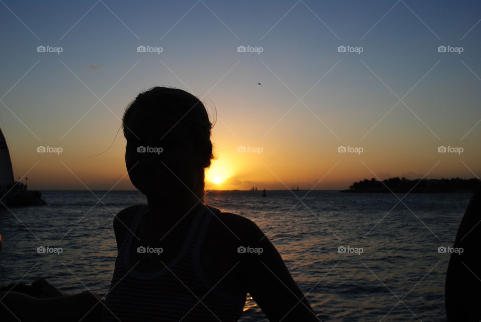 A girl and beautiful sunset in Key West, Florida