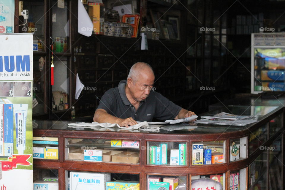 Oldman Reading Newspaper