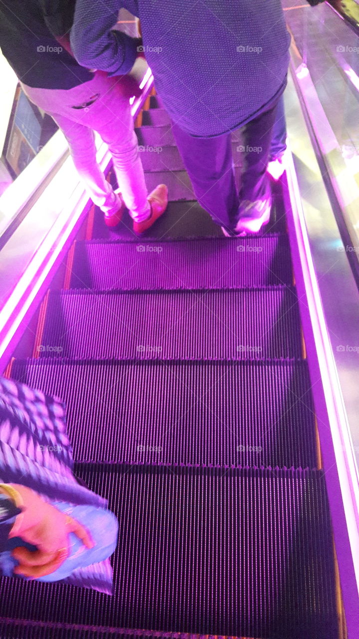 Beautiful purple hues in an escalator in a shopping mall in Chennai.