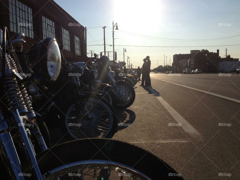 Motorcycles of various makes and models lined up at the Oily Souls event in downtown Detroit