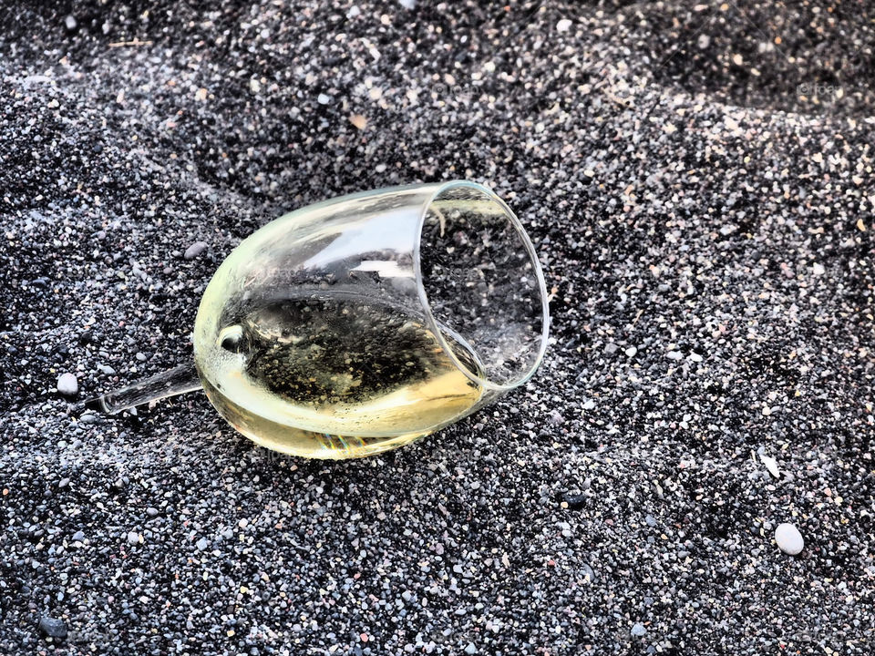 Wineglas in the sand. 