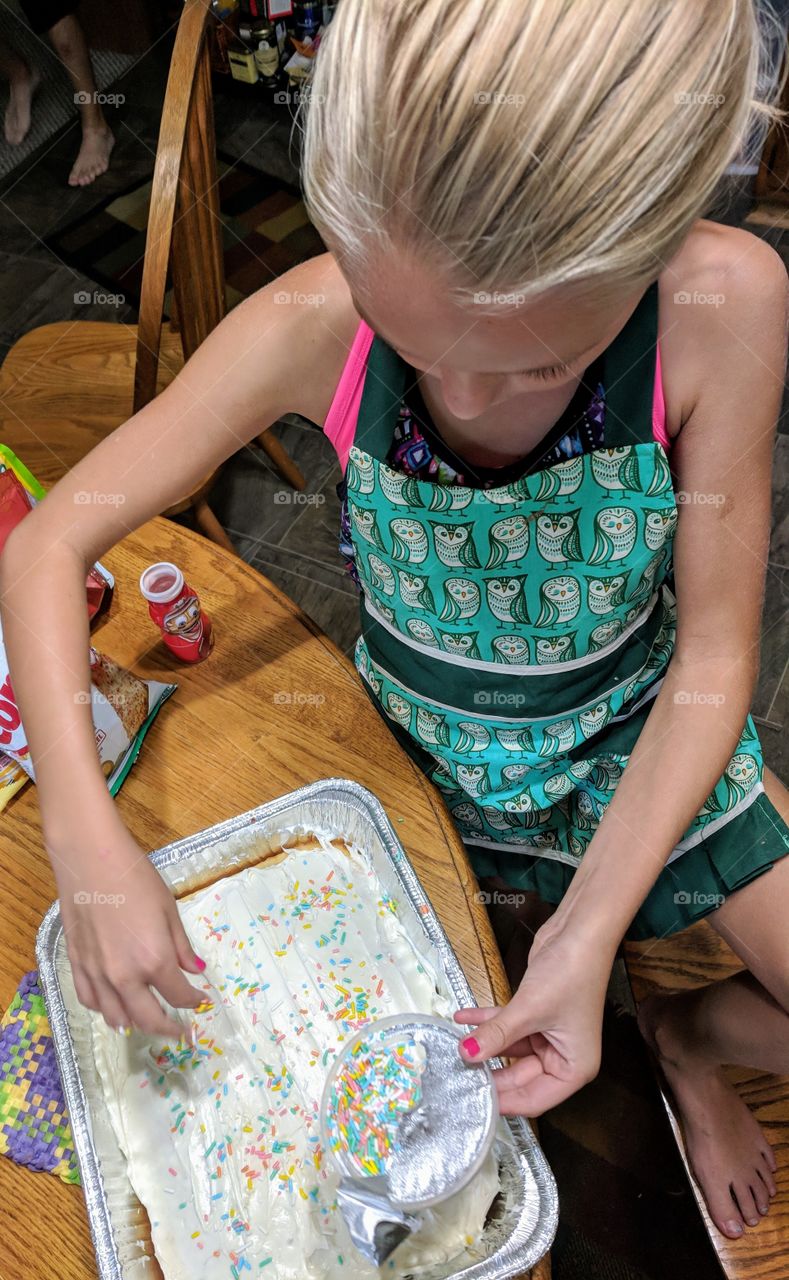 child baking cake