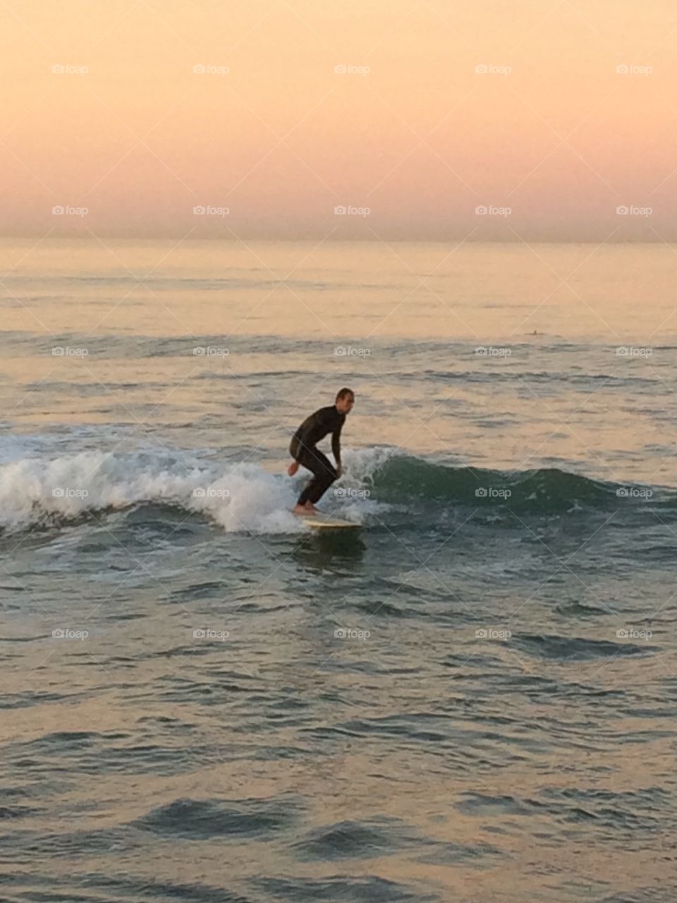 Sunrise Surfer. Sunrise Surfing