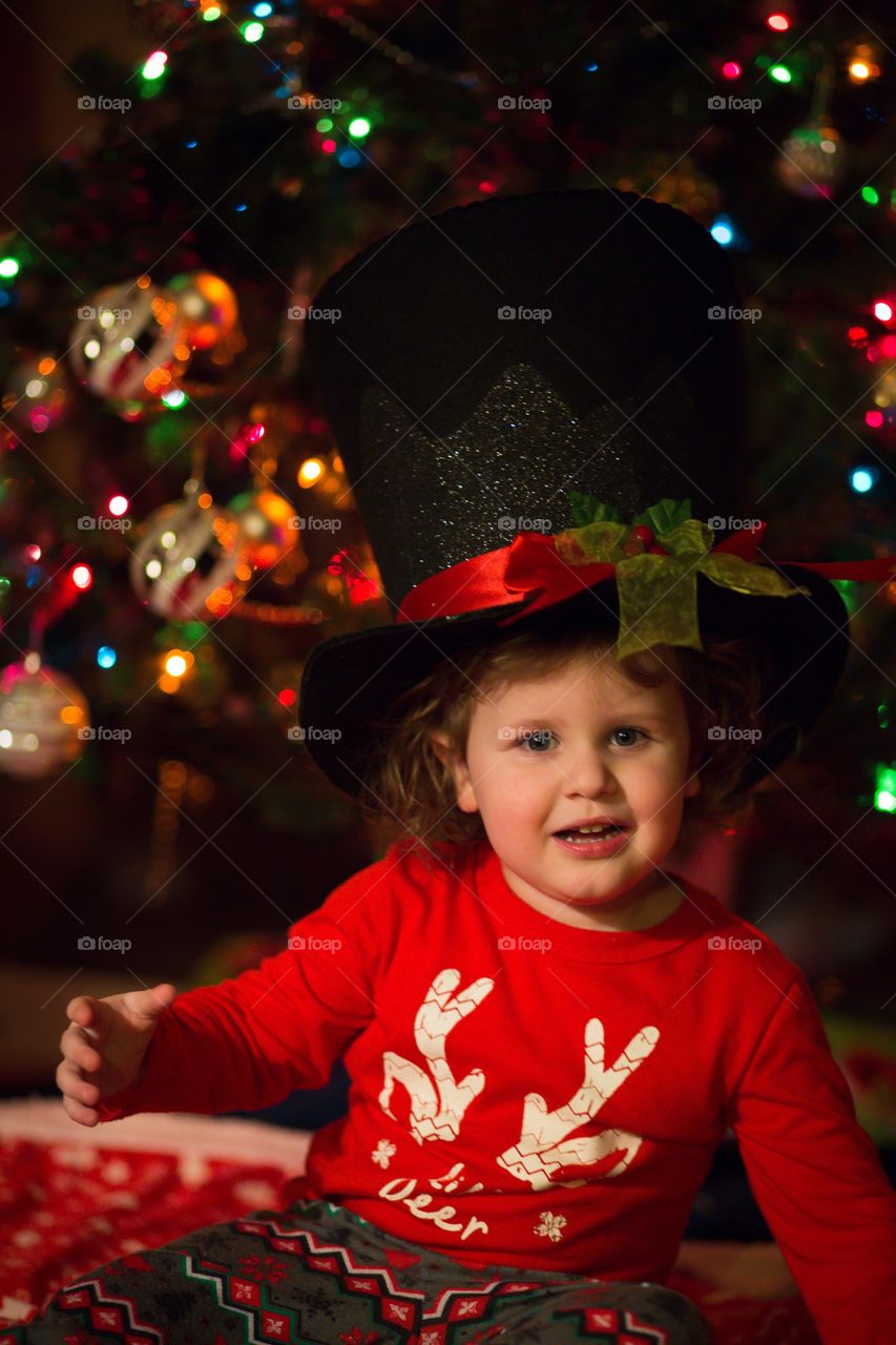 Toddler boy in frosty Christmas hat