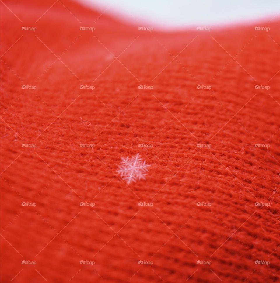 Snowflake on red textile