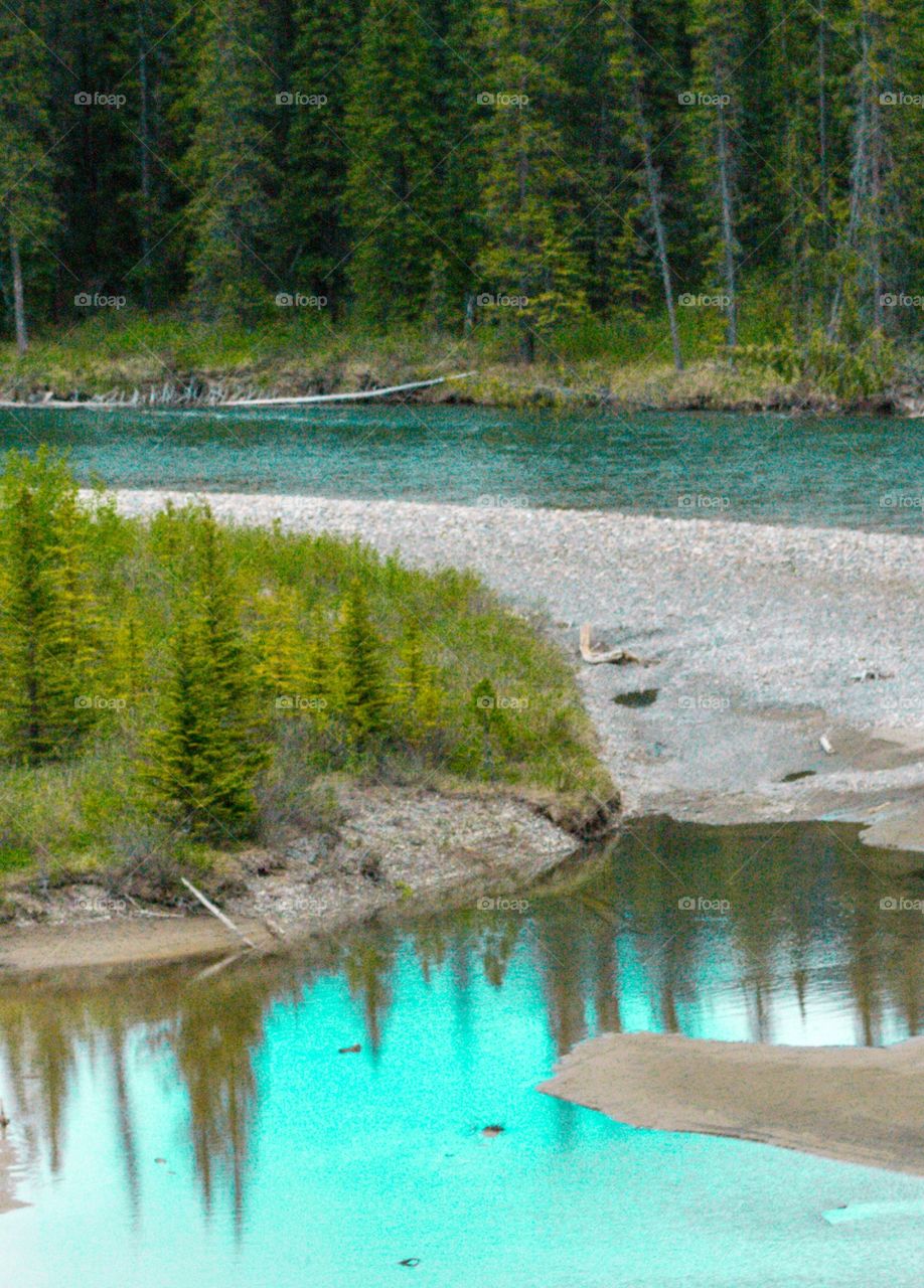 Winding glacial fed river Canada Rocky Mountains
