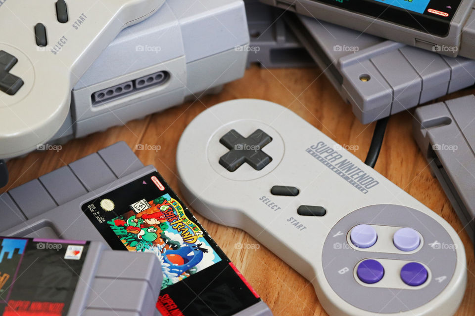 Retro Super Nintendo with controllers and cartridges