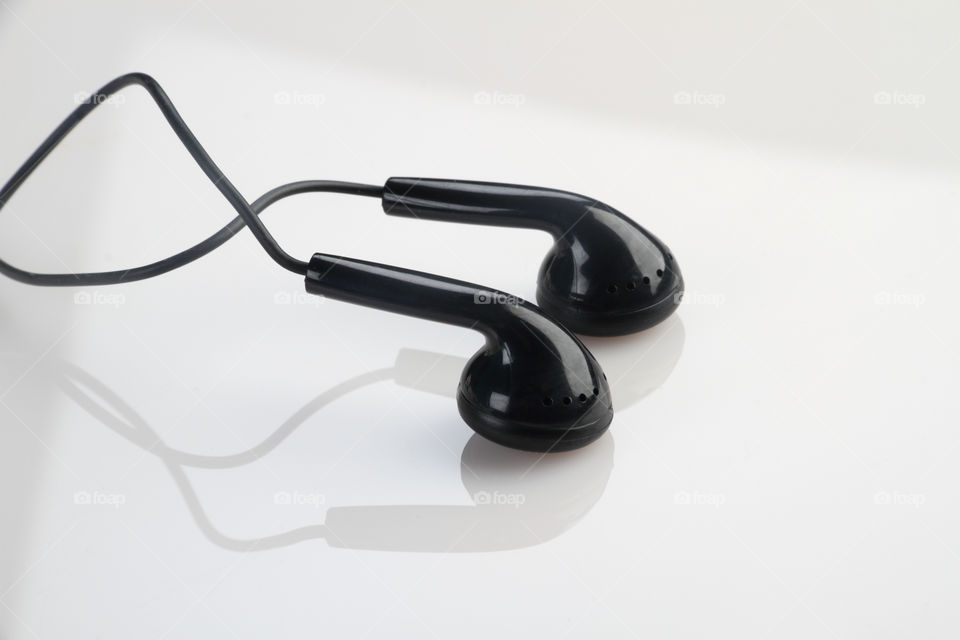 Black headphones earphones on white background