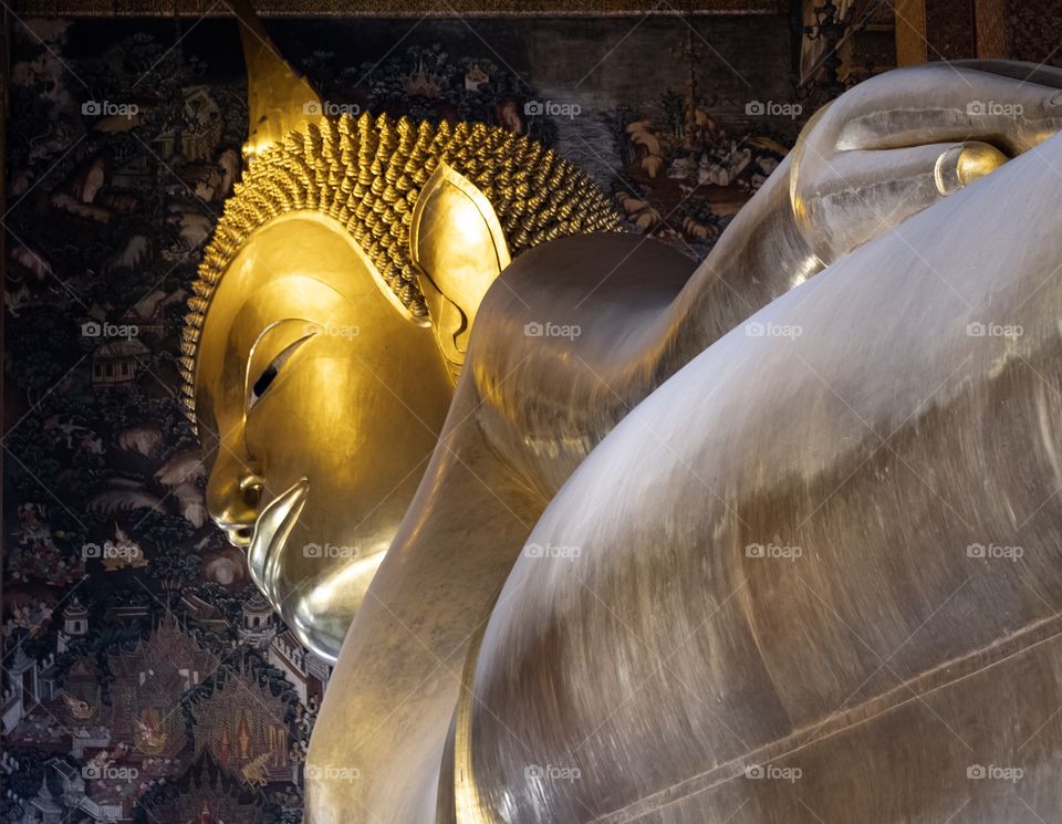 Beautiful view of The big Reclining Buddha at Wat Pho ,the Temple of  the Reclining Buddha Bangkok Thailand