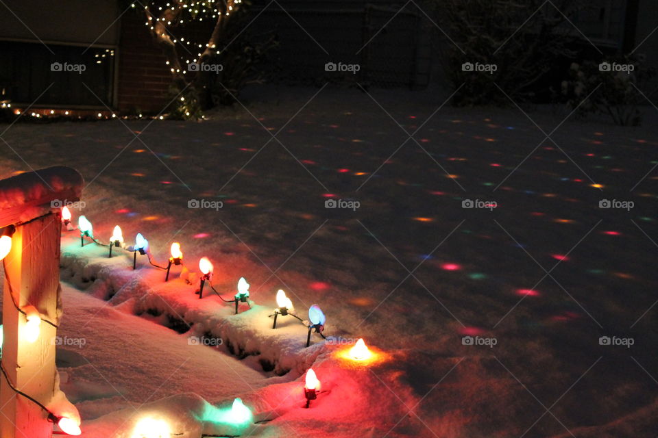 Christmas lights under the snow