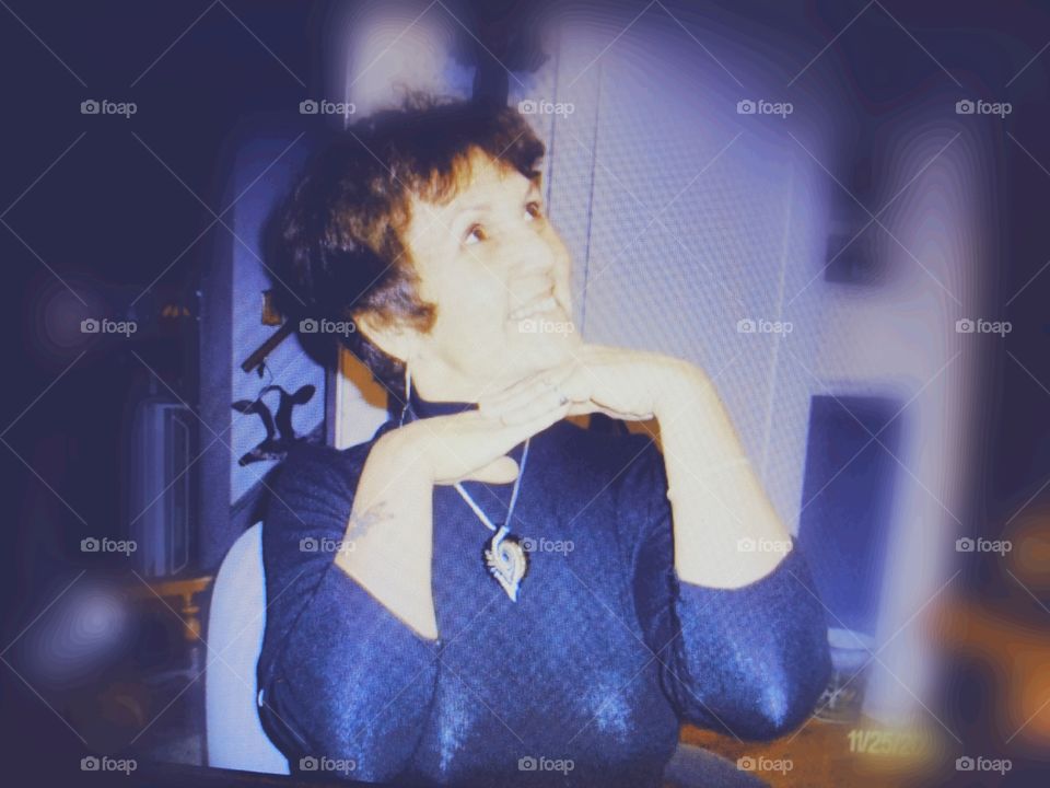 Girl posing like a model, smiling.