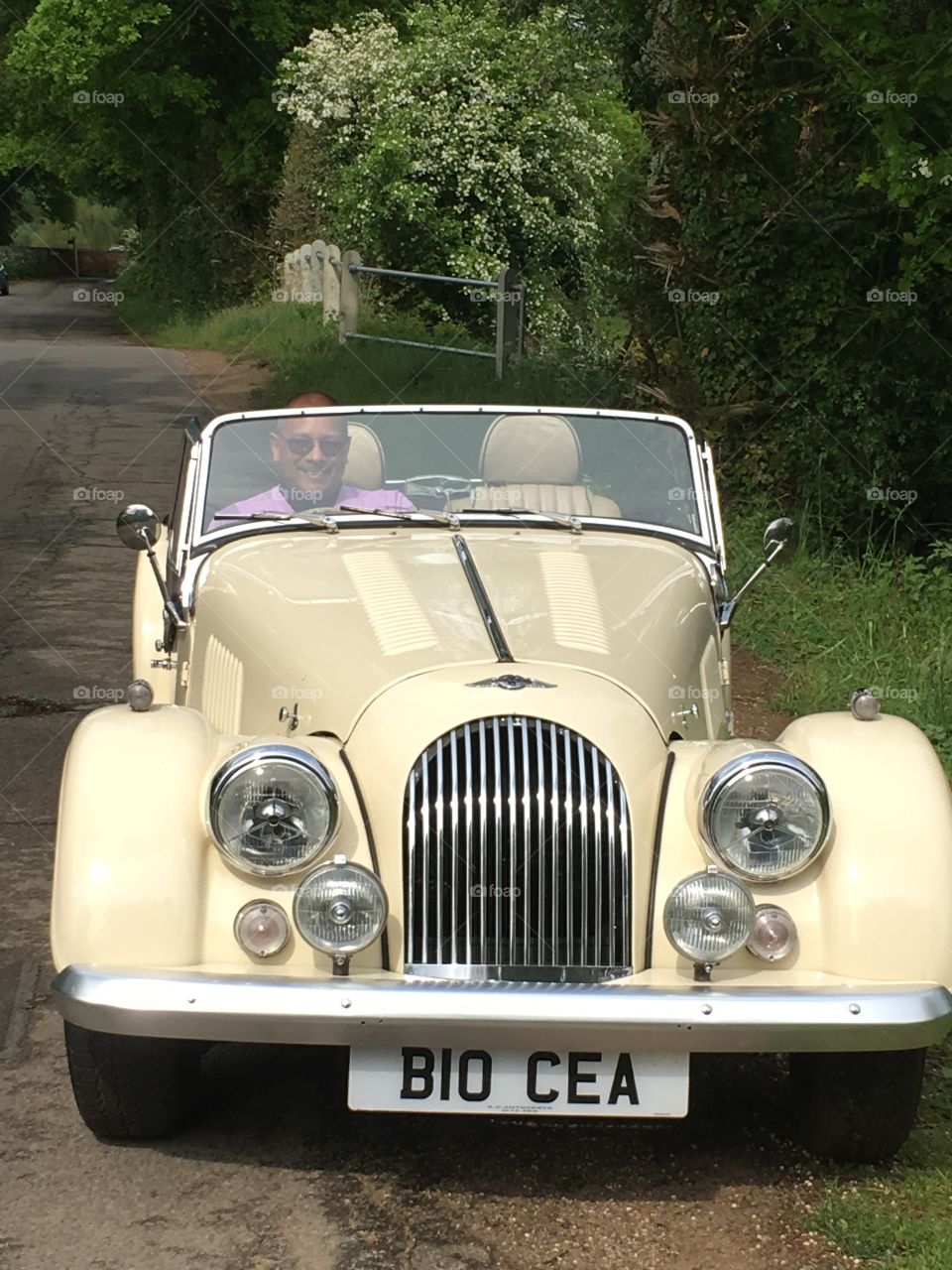 Mature man driving vintage car