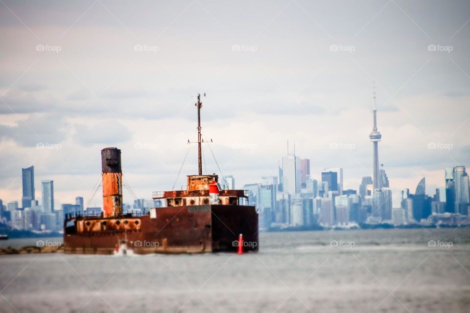 Boat docked at toronto harbour