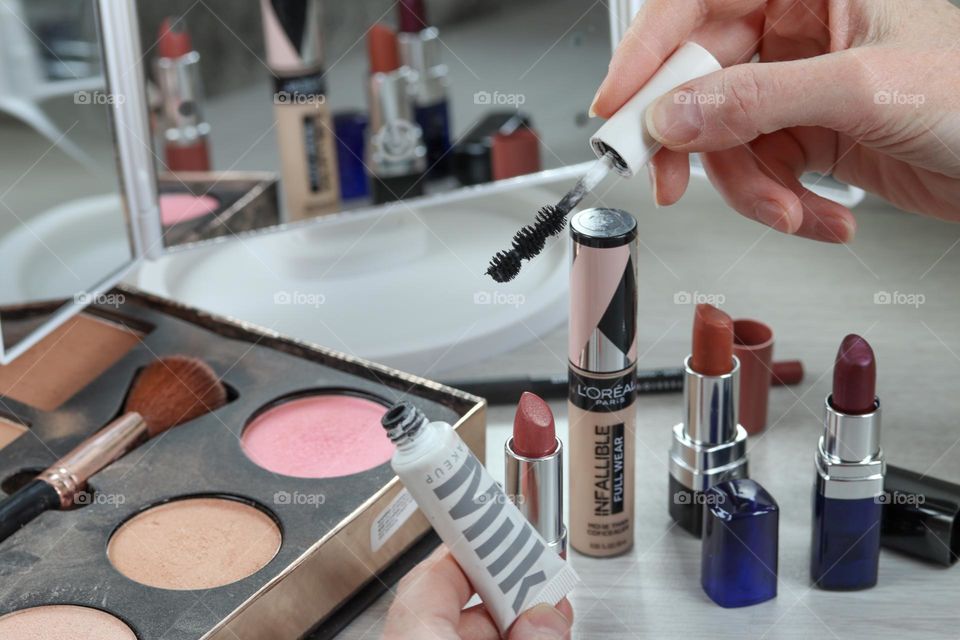 Woman and makeup products