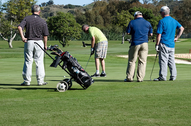 Golfers on Putting Green 