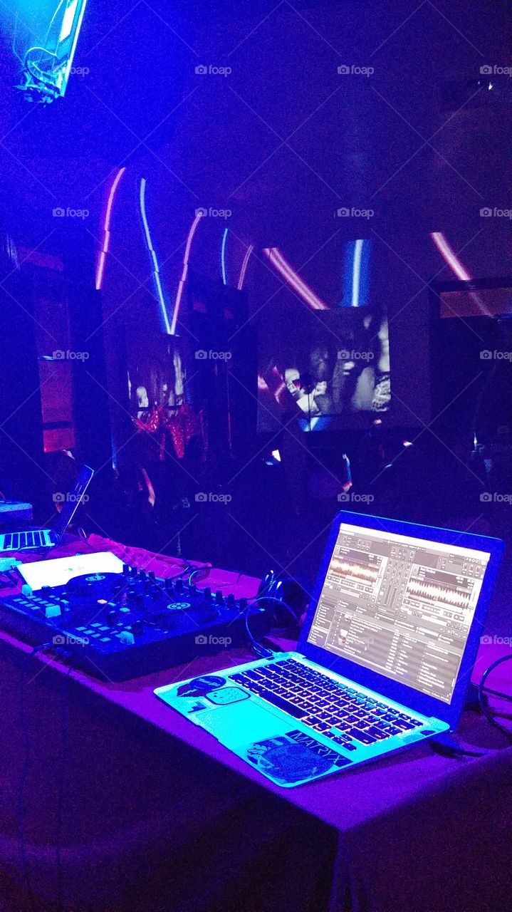Nightclub DJ Equipment Under Blacklights
