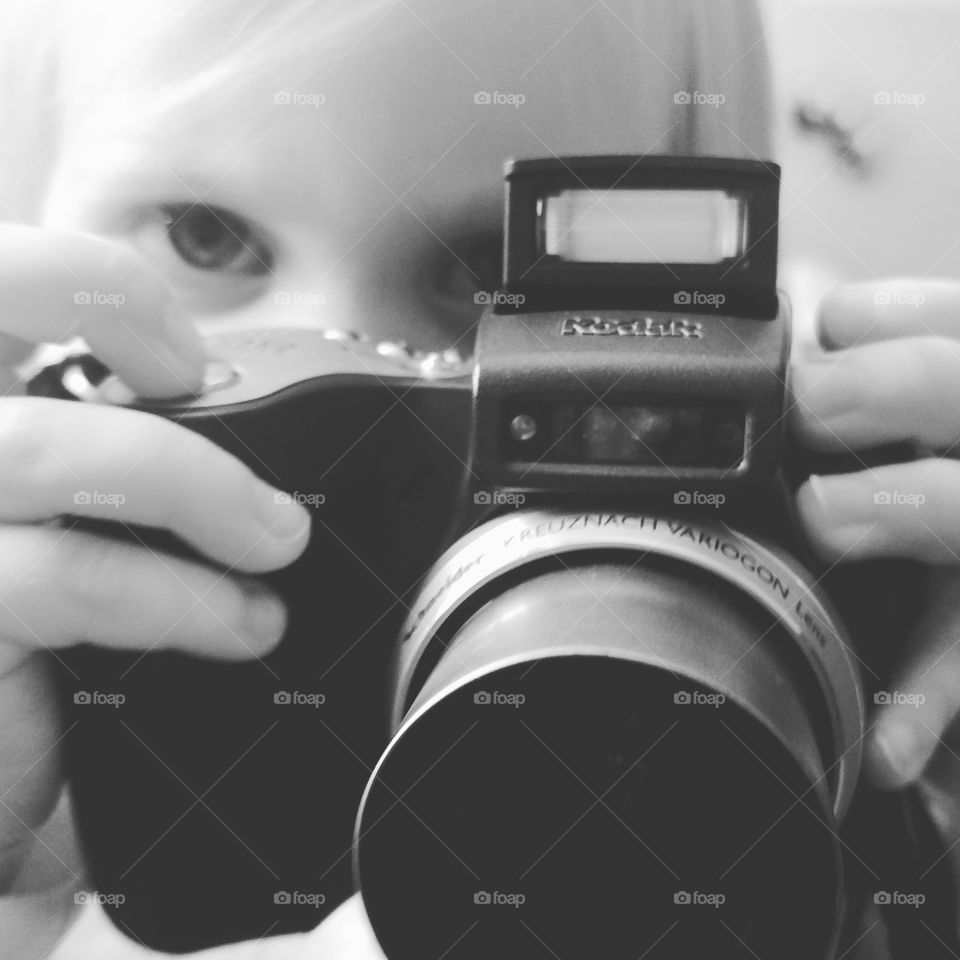 young child with her first camera